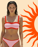 Front view of a pink bikini with red trim against a cream background